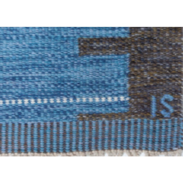 Crafted by celebrated Swedish textile designer Ingegerd Silow, this vintage flat weave rug exemplifies the timeless grace...