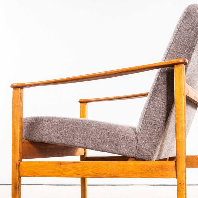 1950’s Mid Century Upholstered Grey Brushed Cotton Armchairs With Straight Arms and Top Caps. Sourced in Scandinavia these...