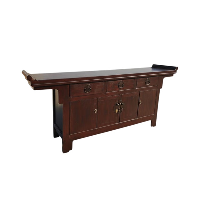 This late 19th century elm sideboard is crafted from solid elm wood with a rich, dark brown lacquer finish. The top...