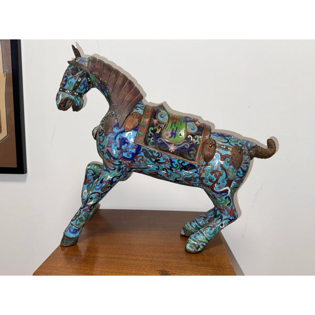 A commanding presence in any collection, this large antique Chinese cloisonné horse is a masterwork of the enameling...