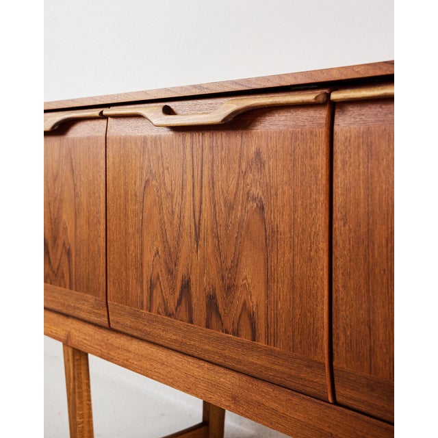 Restored Teak Sideboard from Stonehill, 1950s, in Restored conditions. Designed 1950 to 1959 This piece has an attribution...
