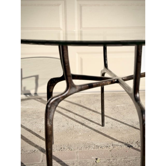Bronze Sculptural Antique Bronzed Iron Legs Round 48” Glass Top Cyrano Dining Table by Made Goods For Sale - Image 8 of 11