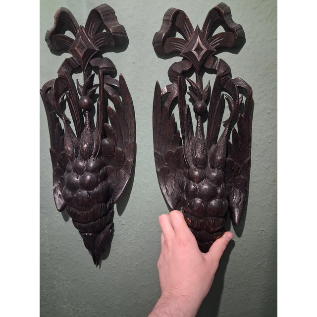 Antique Black Forest Wall Ornaments – Hand-Carved Walnut, 19th Century A stunning pair of antique Black Forest wall...