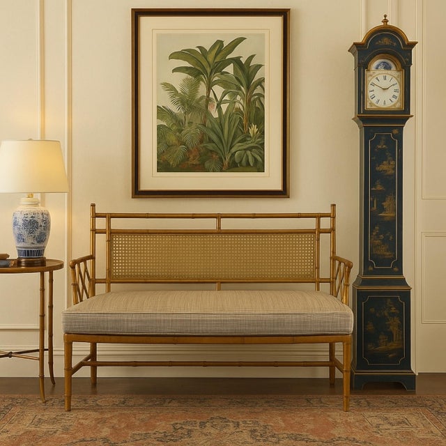 This is a Hollywood Regency era carved giltwood faux bamboo settee. The small plaid upholstery is vintage and in very good...