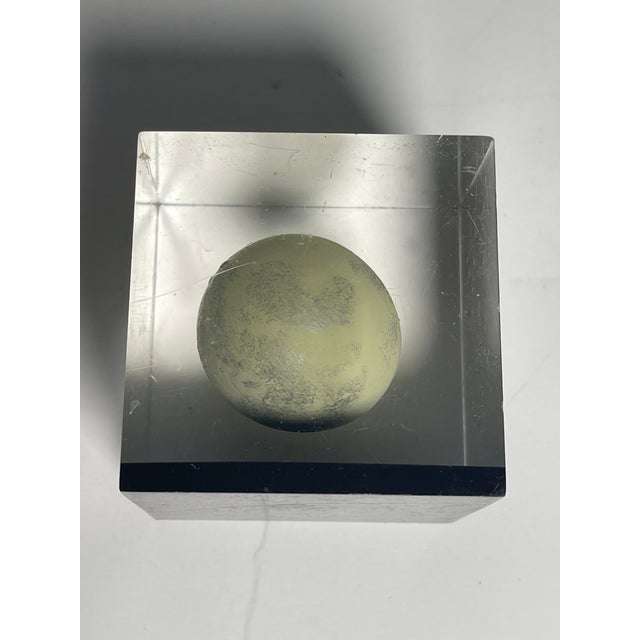 Mid century modern lucite cube with suspended ball paperweight.