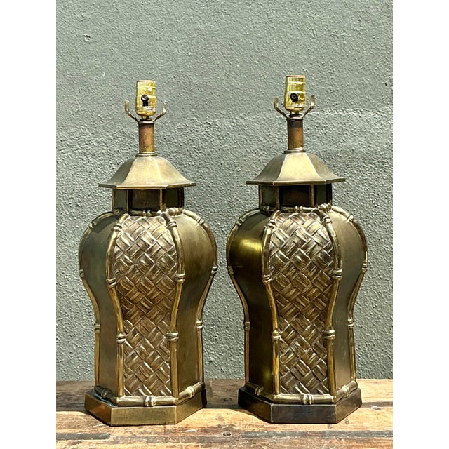 This exquisite pair of vintage Hollywood Regency table lamps masterfully blends Chinoiserie elegance with textural...