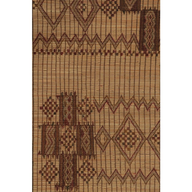 Made with handwoven reed and camel leather in Mauritania circa 1950-1960, this 4x5 vintage Tuareg mat is an exceptional...