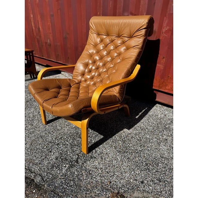 This chair was designed by Noboru Nakamura in the 1980's. Attributed. Its made of beechwood. The chair is upholstered in a...