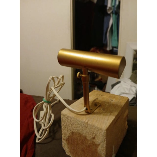 A 1970's tiny 4" wide by 4.5 " tall brass picture/ piano lamp this vintage piece . ( mounted on block for demonstration )....