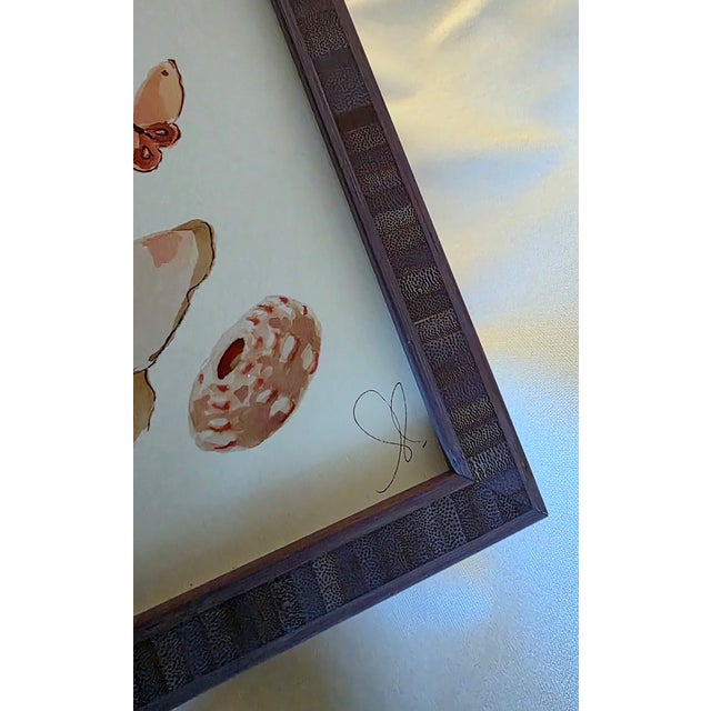 Limited edition print on archival paper depicting an assortment of shells and butterflies Signed by artist Custom framed...