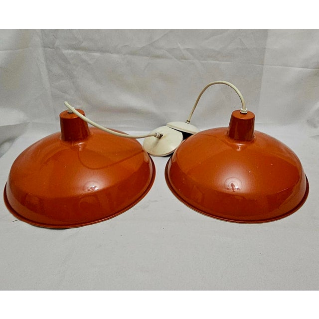 1980s Industrial Dome Orange Pendant Light Fixtures - A Pair These industrial lights were acquired from a Red Lobster that...