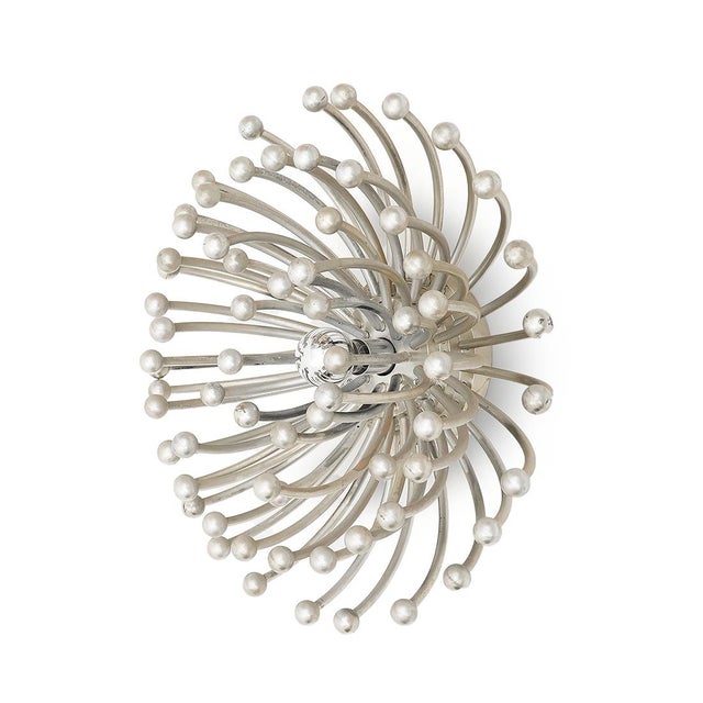 An iconic 1970s design, the “pistillo” lamp features a sculptural structure composed of multiple curved elements made of...