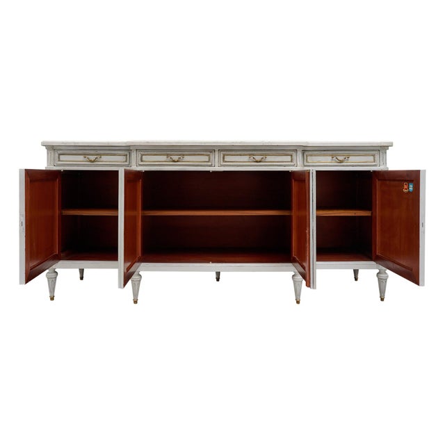 Buffet from France in the Louis XVI style. This enfilade is made of solid wood construction, primarily mahogany. It has...