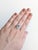 A rare santa maria aquamarine shines in a deep sea-blue at the heart of this solid 14K white gold ring, framed by thirteen...