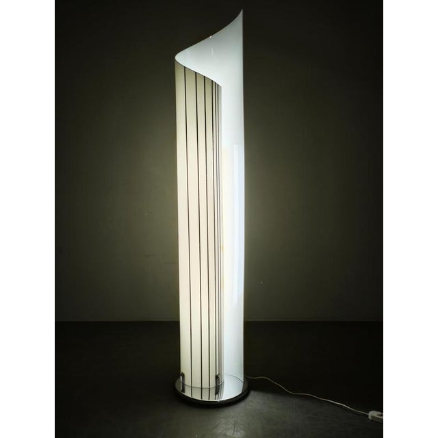 Exceptional italian postmodern floor lamp from the 1980s, distinguished by its dramatic sculptural construction and...