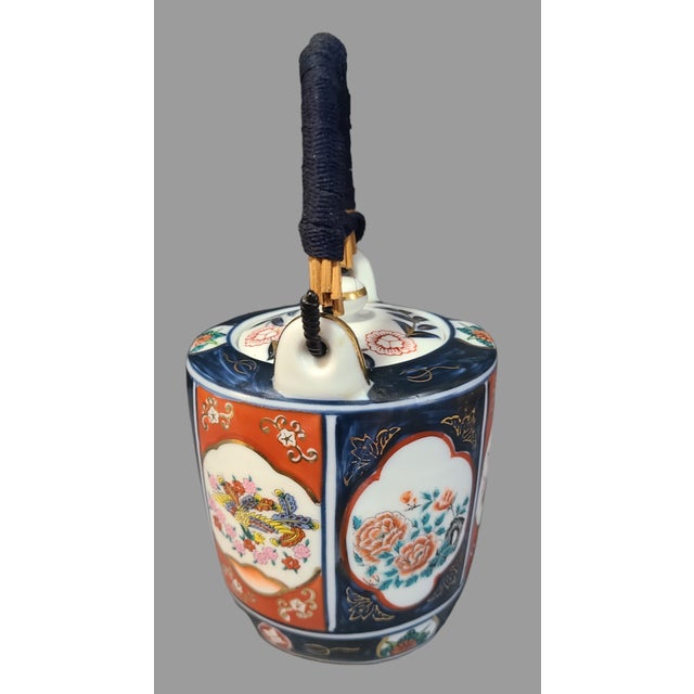 This vintage teapot is a stunning piece of Japanese craftsmanship. The intricate hand-painted floral design showcases the...