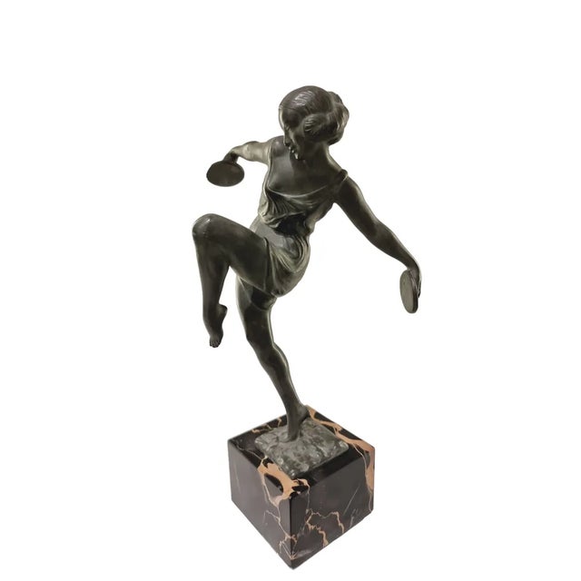 Art Deco statue of a dancing woman with cymbals. Original title "Danseuse Aux Cymbales". Signed Fayral, pseudonym of...