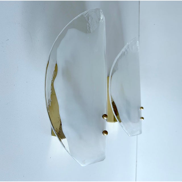 Pair of Vintage sconces with large leaf shaped Murano glass shades, partly milk mounted on a rectangular brass base Very...