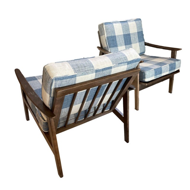 Embrace the charm of the 1950s with this stunning pair of Mid-Century Modern Lounge Chairs. Crafted from robust oak, these...