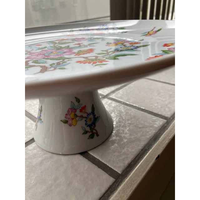 Fun colorful le jardin pattern by dolphin made in Japan cake plate on a pedestal. So colorful white background with pink...
