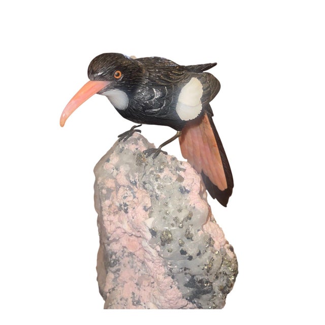 A finely executed late 20th century multi-gemstone carving from Idar-Oberstein, Germany, depicting a Black-cowled Oriole...