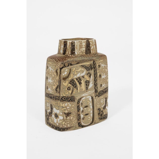 A sculptural royal copenhagen faience vase featuring richly detailed hand-decorated motifs and earthy scandinavian tones....