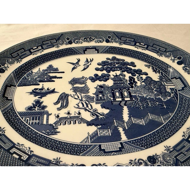 Add timeless English charm to your collection with this **Vintage MCM Johnson Bros England Blue & White Willow oval...