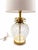 A charming pineapple-form table lamp featuring a substantial faceted clear glass body with layered antiqued gilt-metal...