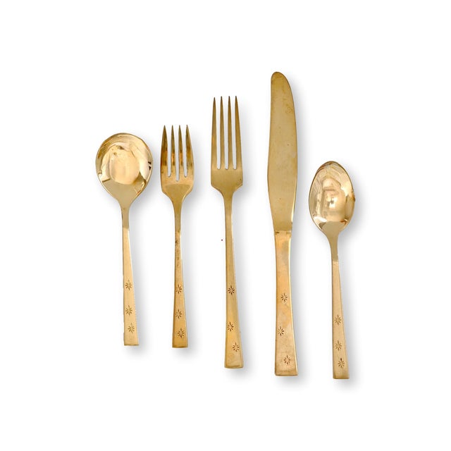 1960s Dirilyte flatware service for eight in the sought-after Atomic Star pattern, including 40 pieces plus an additional...