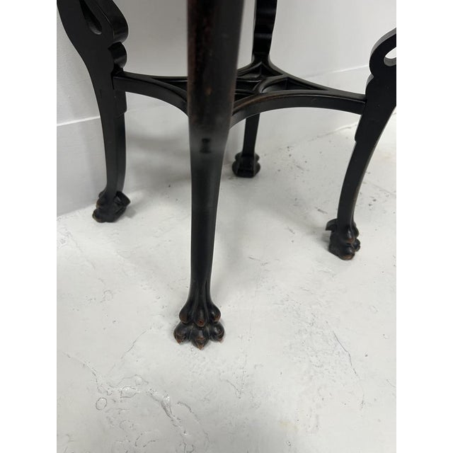 Oval side table in Asian style, made of natural wood Four claw feet with stretchers One drawer in the apron Top with white...