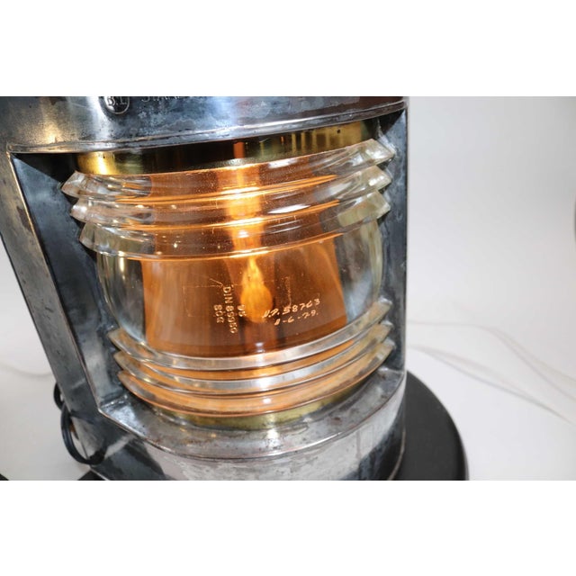 Pair of polished and lacquered ships port and starboard lanterns with clear glass fresnel lenses, vented chimney tops,...