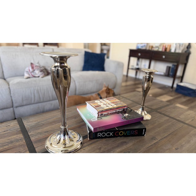 Pair of Global Views Polished Nickel Graduated Candlesticks Price $495 Description An elegant pair of authentic Global...