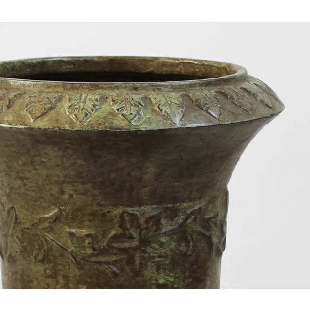 Cast iron garden urn with beautiful vintage green patina. Opening at the top measures 12", opening at the base measures 9".