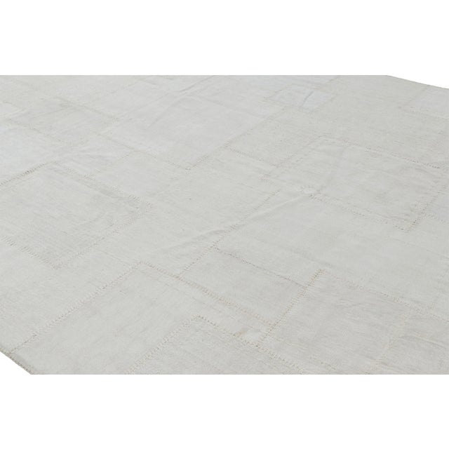 Handwoven in a wool flat weave, this 10x13 patchwork Kilim rug from Rug & Kilim uses Kendir, a kind of all-natural "bast"...