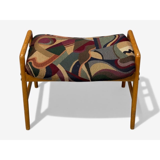 Danish Mid-Century Modern, Aztec Fabric, Light Stained Wood, Footstool or Ottoman, Denmark, 1950s A fabric and light...
