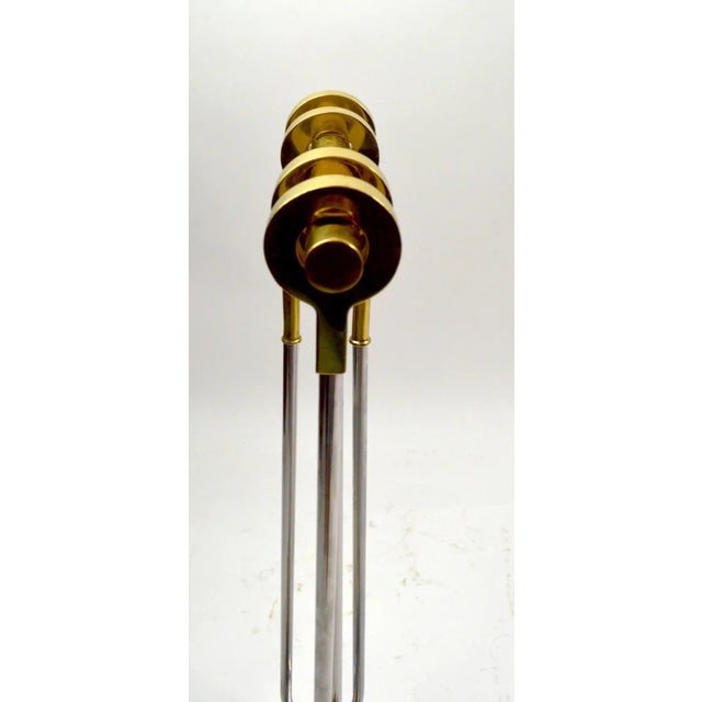 High quality modernist chrome and brass fireplace tool set made by Danny Alessandro. Four tools with brass ring handles...