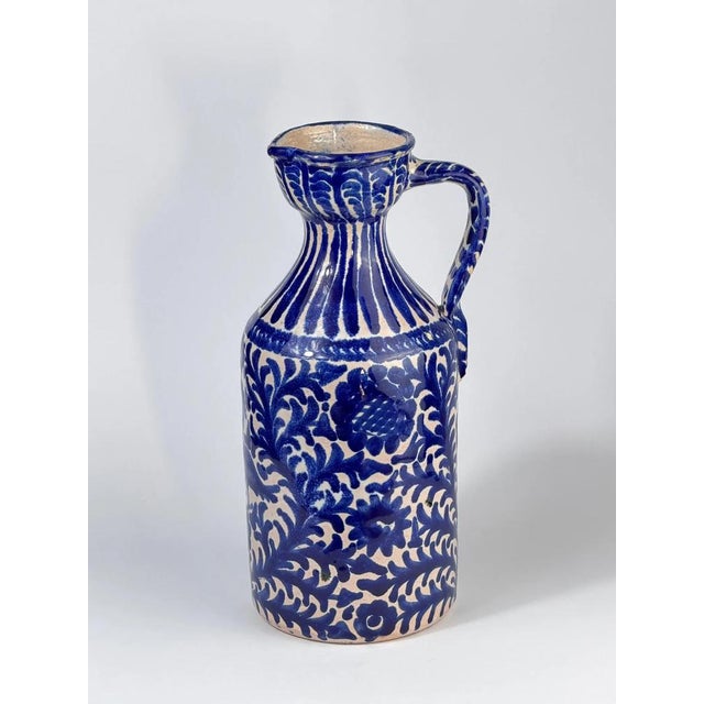Authentic mid-20th-century Fajalauza ceramic pitcher from Granada, Spain, hand-painted in the traditional blue and white...