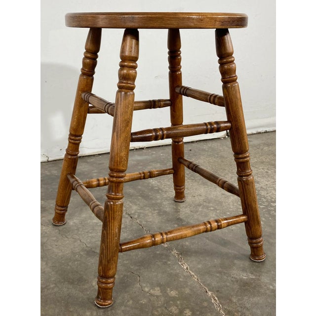 Vintage tall turned wood stool with rich chestnut finish. Seat measures 14"dia, making ideal candidate as a seat or...