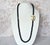 An extraordinary and deeply charming necklace, where sculptural elegance meets quiet whimsy. This rare piece is crafted...
