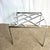 A striking Mid Century Modern table featuring a geometric chrome lattice base beneath a clear glass top. The sleek,...
