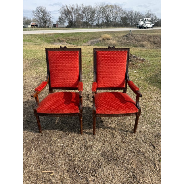 Large Pair of French Louis XVI Armchairs from France made of solid mahogany, the wood has been finished with a lustrous...