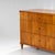 Biedermeier chest of drawers veneered in cherrywood, standing on tapered square legs. Its clean, minimalist design...