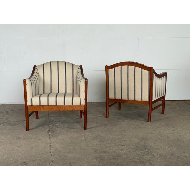 This pair of lounge chairs was produced by Form 75 in Galten, Denmark, identified by the manufacturer's label to the...
