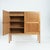Danish teak two door cabinet by Kurt Ostervig by Randers Möbelfabrik with brass hinge detail. Two interior drawers and...