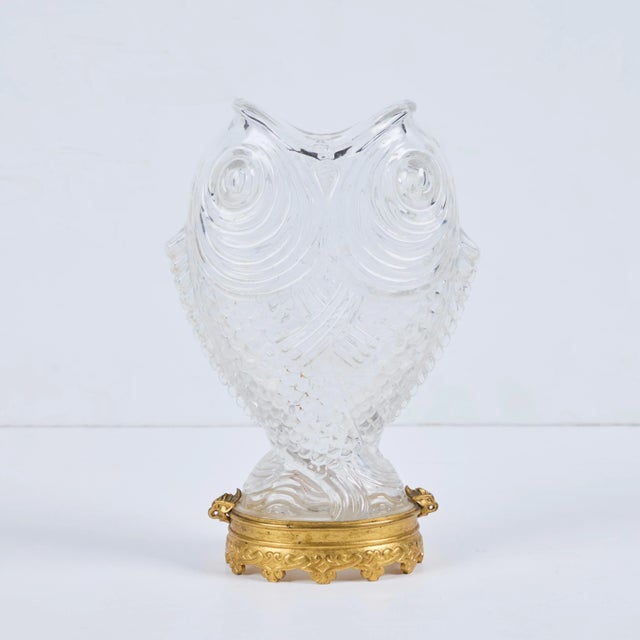 Antique Baccarat “Double Carp” molded crystal vase mounted on a gilded bronze base.