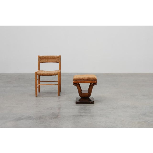 A refined and sculptural Italian Art Deco stool from the early 1920s, crafted in richly toned walnut and showcasing the...