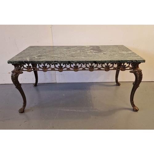 Coffee table with marble top.Brass, marble.France.1970s.Size: height 44cm; length 93cm; width 50cm