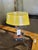 Vintage Yellow Table Lamp Dims.: 10"Diameter x 15"H Material: Parchment Shade. metal Circa: 1970's Origin: Italy