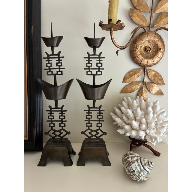 A pair of vintage brass Chinese "Double Happiness" candlestick holders. Traditionally given as a wedding gift for good...