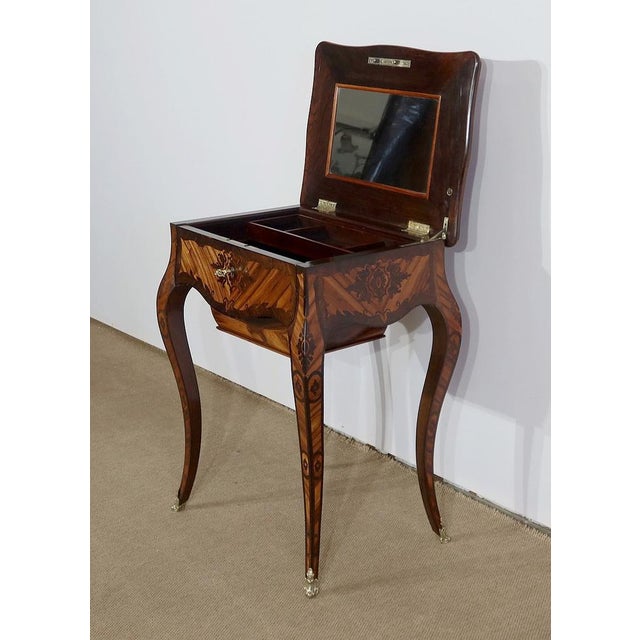 Louis XV worker in rosewood and rosewood marquetry, made in a Parisian workshop in the mid-19th century. This rare piece...